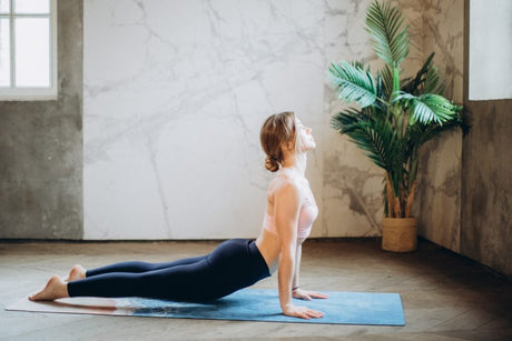 Woman doing yoga poses for relaxation.