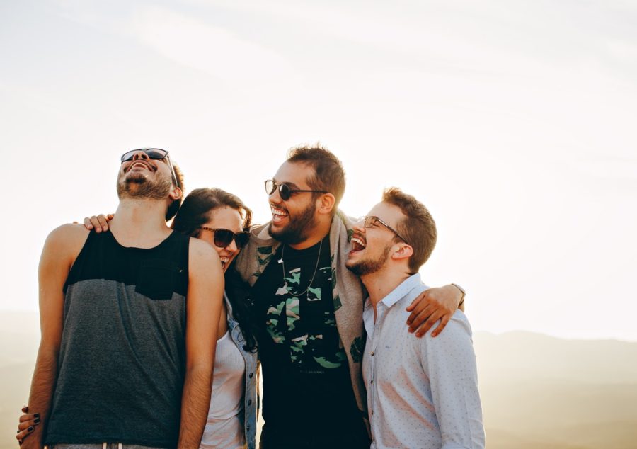 four friends laughing